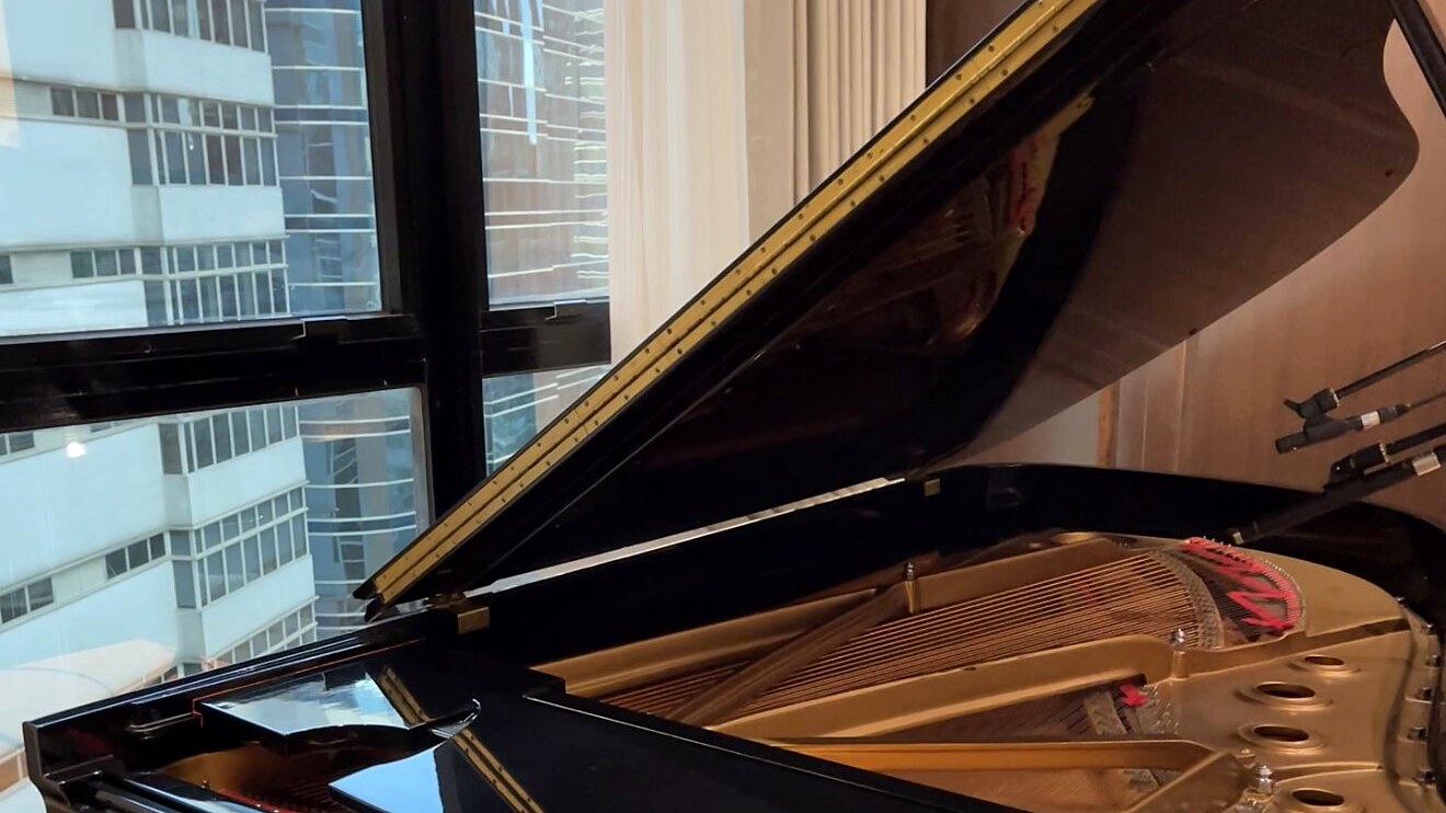 Steinway grand piano with Hong Kong skyline view at Studio Tableau