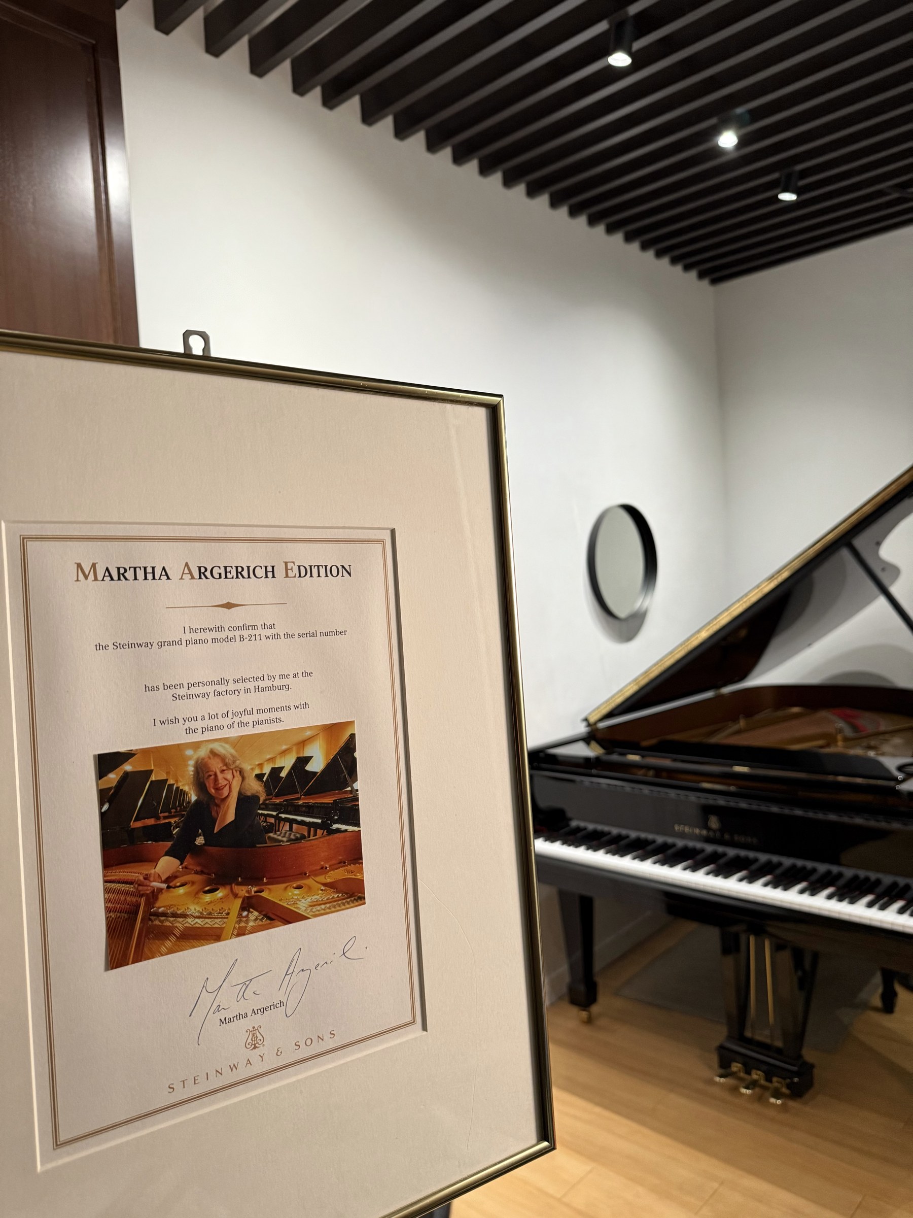 Martha Argerich Edition certificate beside the Steinway grand at Studio Tableau